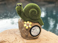 Solar Powered Garden Snail On Rock Sculpture In Flocked Artificial Grass Decorative Sculpture 13.5 Inches